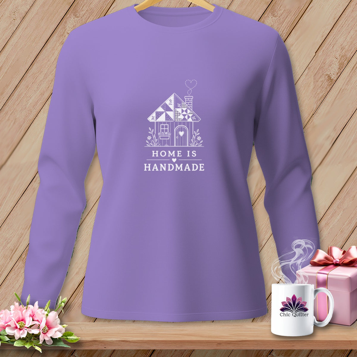 Lavender long-sleeve shirt with "Home is Handmade" text and house graphic.