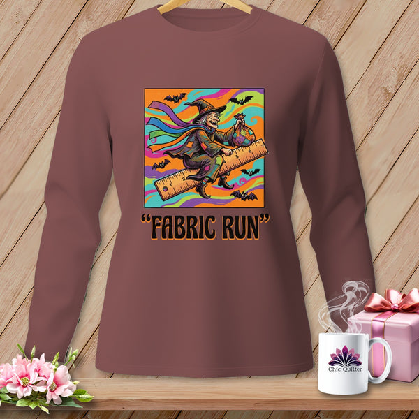 "FABRIC RUN" text with a witch flying on a ruler, surrounded by bats.