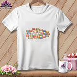 A white short-sleeved t-shirt features a colorful graphic of stacked thread spools on a wooden background.