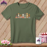 Olive green t-shirt with a graphic of seven cute dogs sitting on folded quilts.