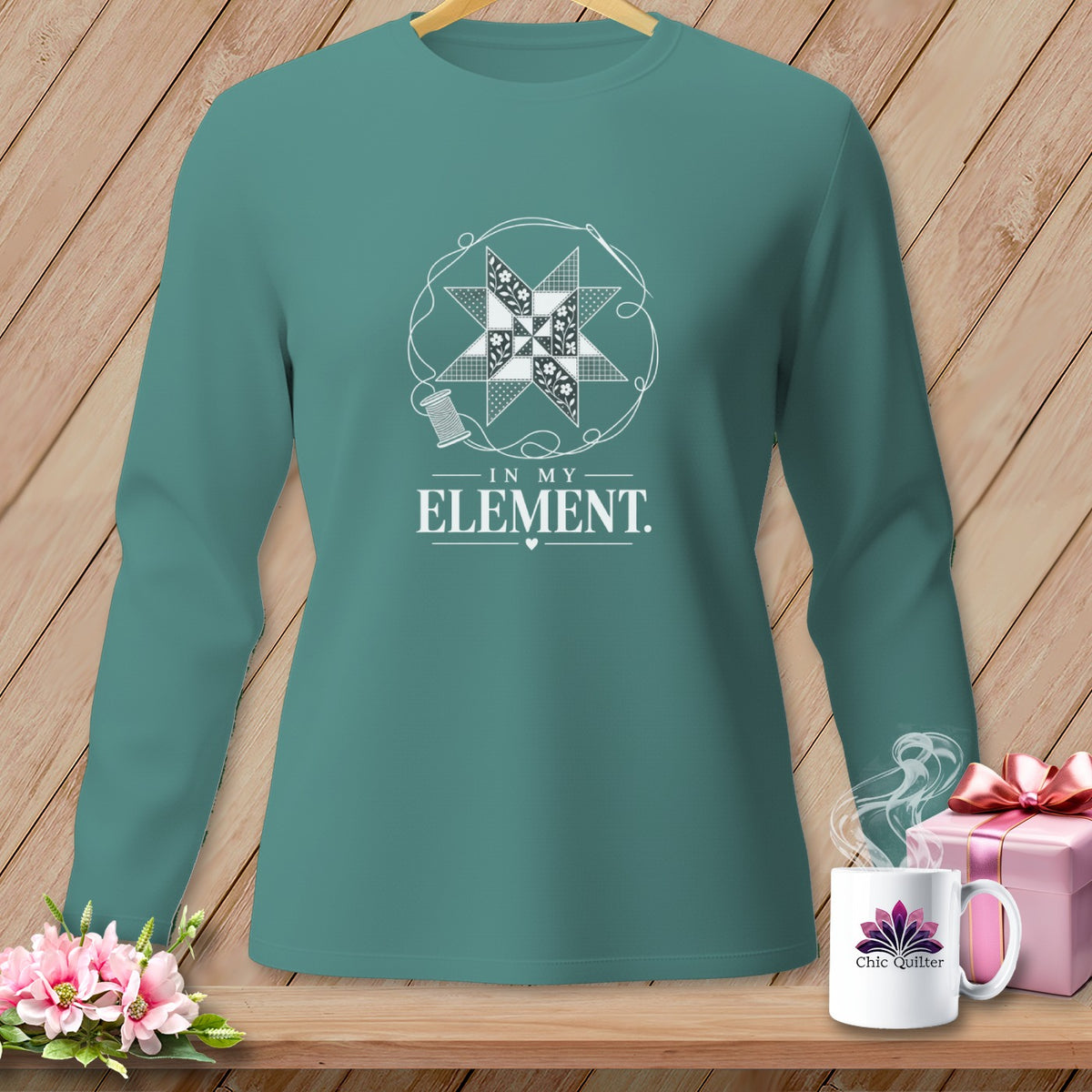 Teal long-sleeve shirt with a quilted star design and "IN MY ELEMENT" text.