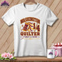 A white t-shirt featuring a Washington Quilter design with a spool of thread, needle, and text.