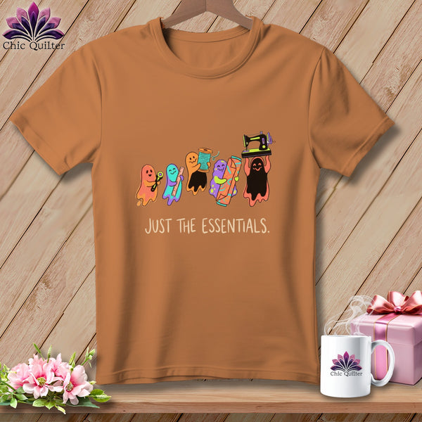 Orange t-shirt with cartoon ghosts holding sewing supplies and the text "JUST THE ESSENTIALS."