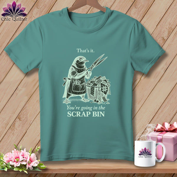 Teal t-shirt with illustration of a bird holding scissors over a scrap bin.