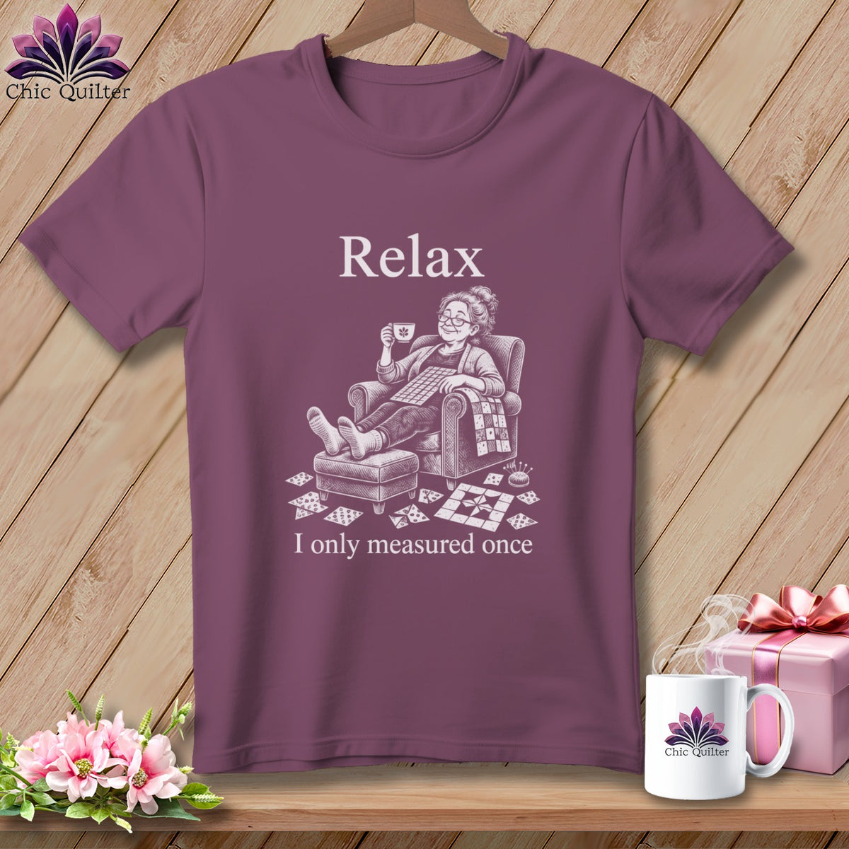 T-shirt with "Relax" and woman with quilt squares, mug, and pin cushion.