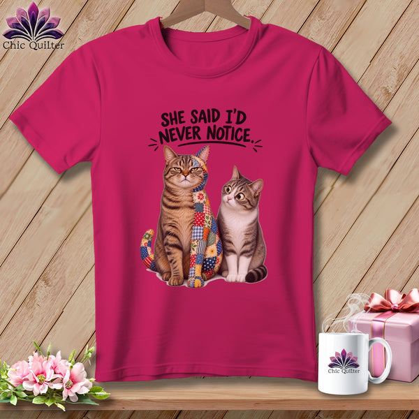 Pink t-shirt with two cats and "SHE SAID I'D NEVER NOTICE." text.