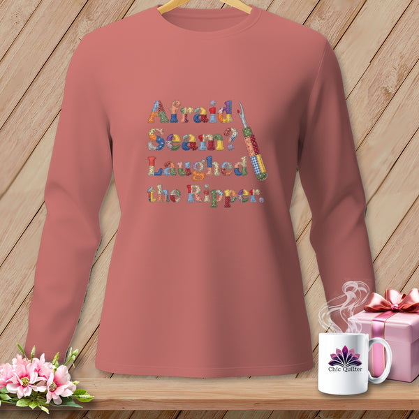 Long-sleeved shirt with "Afraid Seam? Laughed the Ripper." text and sewing tools.