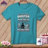Teal short-sleeve t-shirt with white graphic text reading Yes I am a spoiled quilter and a quilting illustration.
