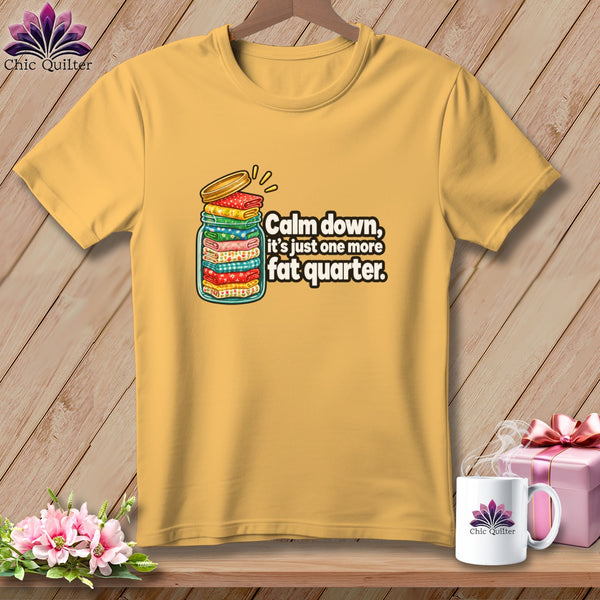 Yellow t-shirt featuring a glass jar graphic filled with folded colorful fabrics and text saying Calm down, it is just one more fat quarter.