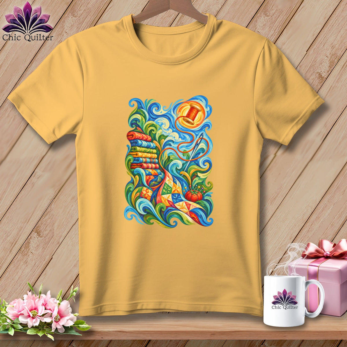 Yellow t-shirt hanging on a wooden background, featuring a colorful swirling quilting graphic on the front.