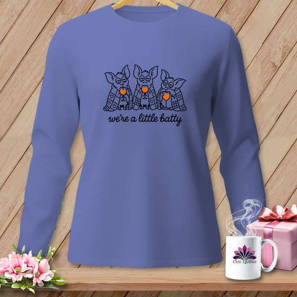 Purple long-sleeve shirt with cartoon bats and "we're a little batty" text.