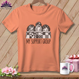 T-shirt with three women peeking over a quilt, text 