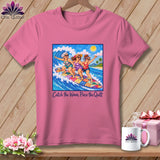 Pink t-shirt featuring an illustration of three women surfing together on a colorful quilt-patterned surfboard.