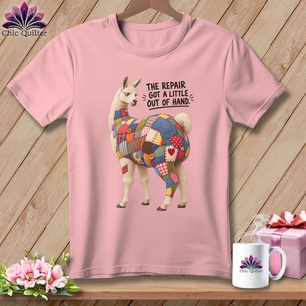 Pink t-shirt with a llama patched with colorful fabric, and text "The repair got a little out of hand."