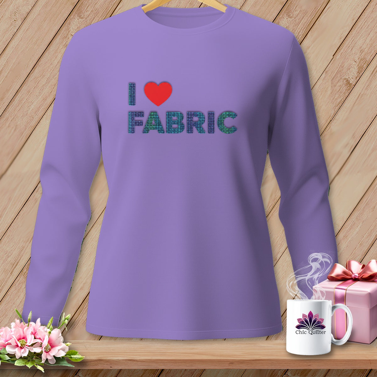 Lavender long sleeve shirt with "I ❤️ FABRIC" graphic.