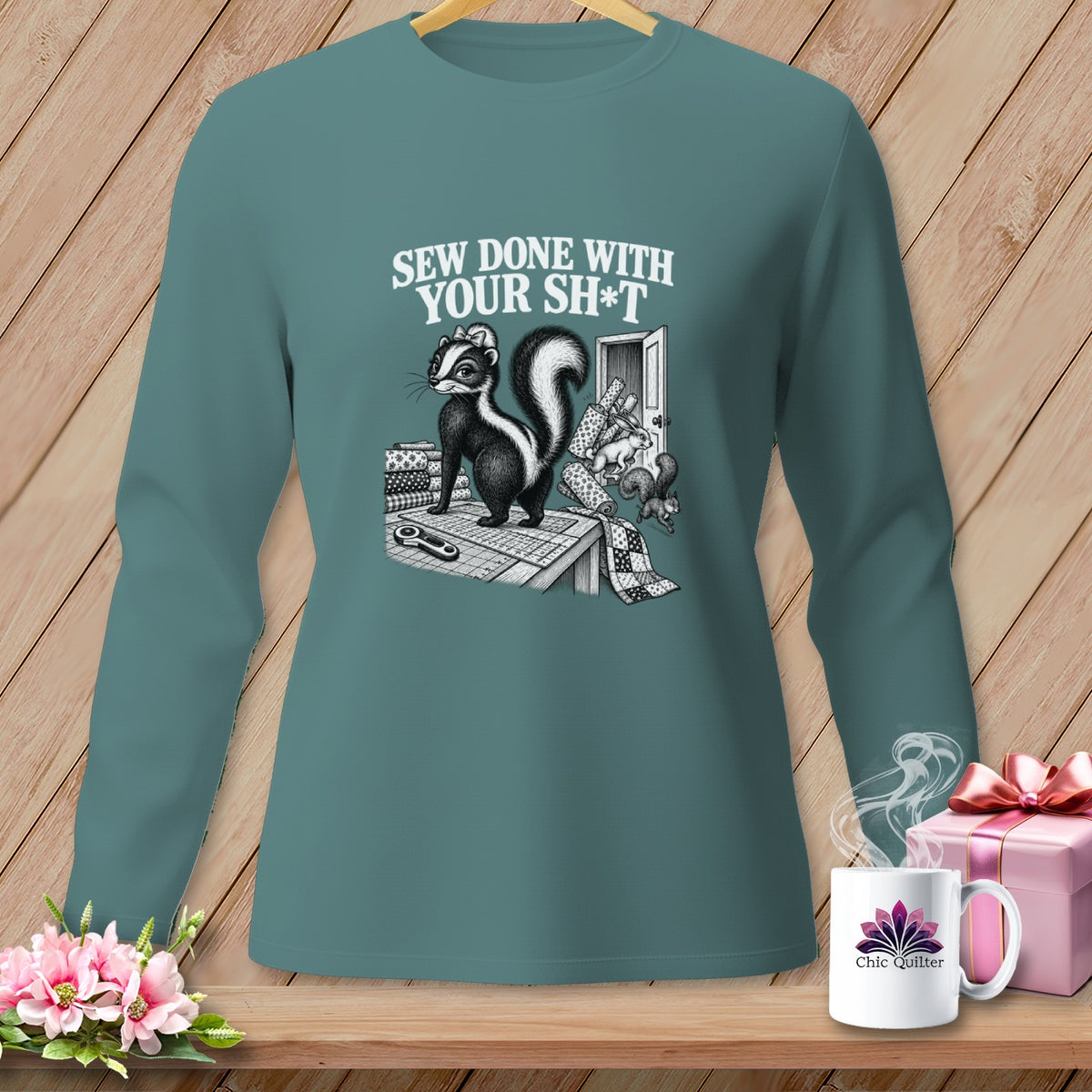 Long sleeve shirt with skunk graphic and "Sew Done With Your Sh*t" text.
