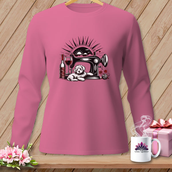 Pink long-sleeve shirt with sewing machine, dog, wine, and yarn graphic.