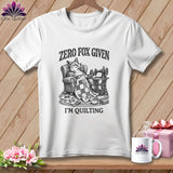 White t-shirt with a fox relaxing with a quilt and sewing machine, reads 