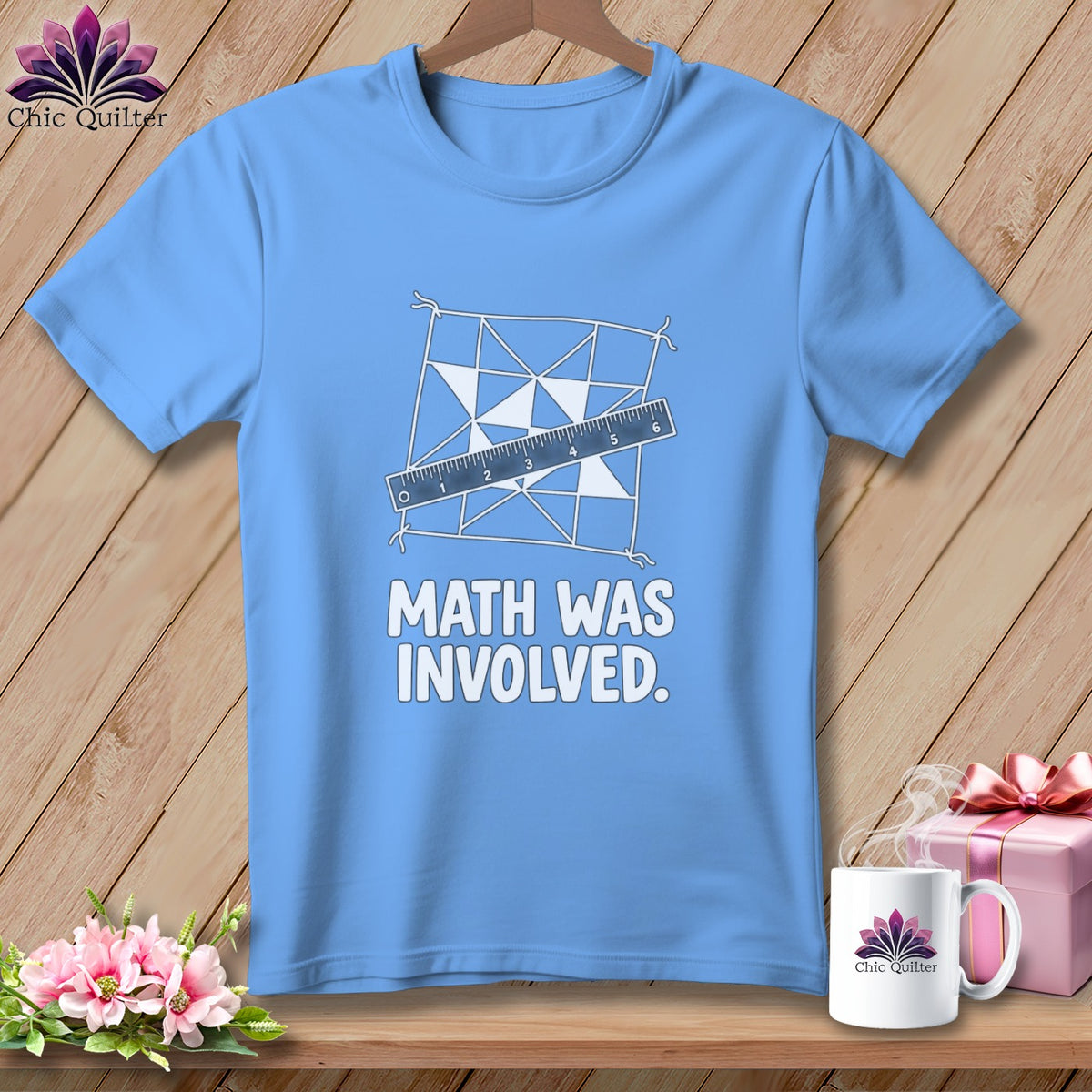 Light blue t-shirt with "MATH WAS INVOLVED" text and quilting design.