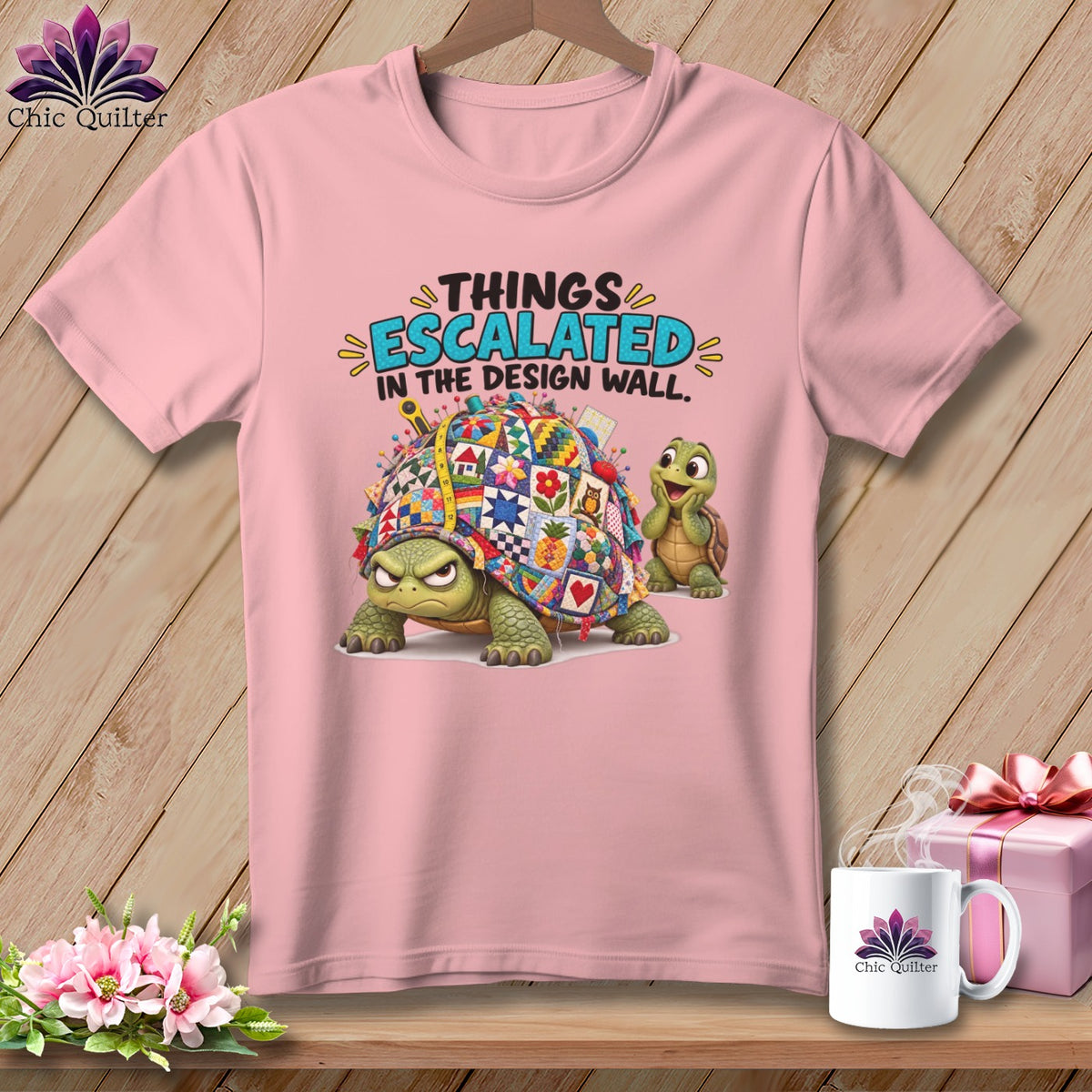 Pink t-shirt with cartoon turtles and quilted shell, "Things Escalated in the Design Wall" text.