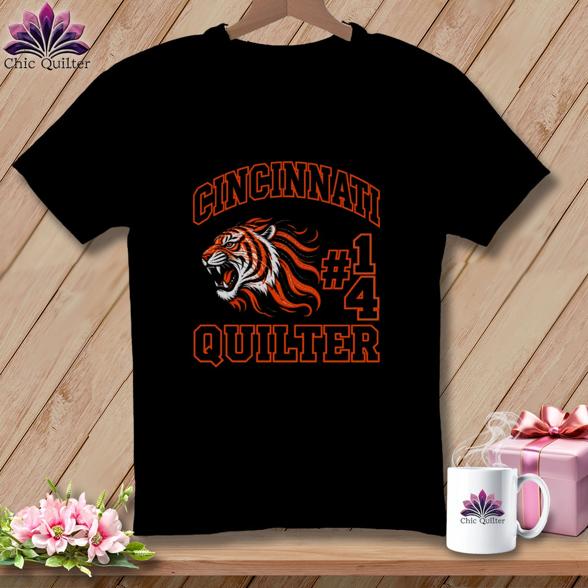 Black t-shirt featuring an orange graphic of a roaring tiger head, the text Cincinnati Quilter, and the number 14.