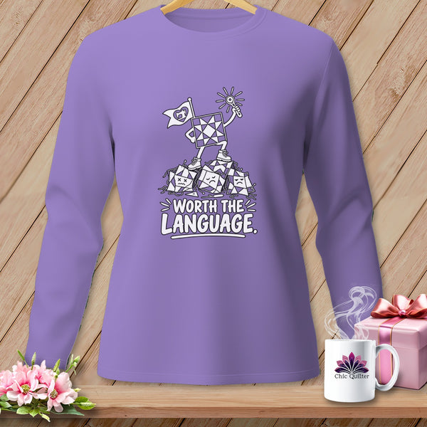 Purple long-sleeve shirt with cartoon quilt blocks and text "Worth the Language".