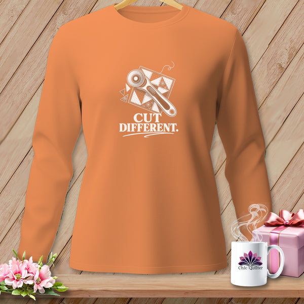 Orange long-sleeve shirt with "CUT DIFFERENT." and sewing graphic.