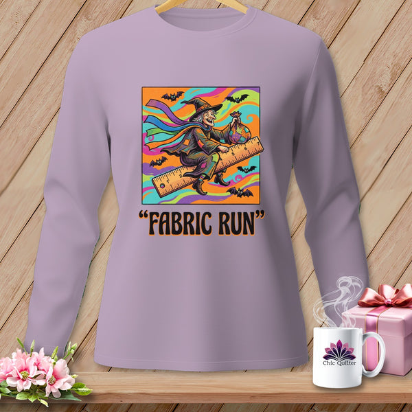 Witch on a ruler with bats and colorful background, text "FABRIC RUN".