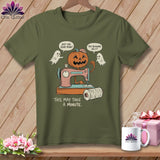 Pumpkin on sewing machine with ghosts and text 