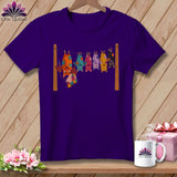 Purple t-shirt with cartoon bats hanging on a clothesline.