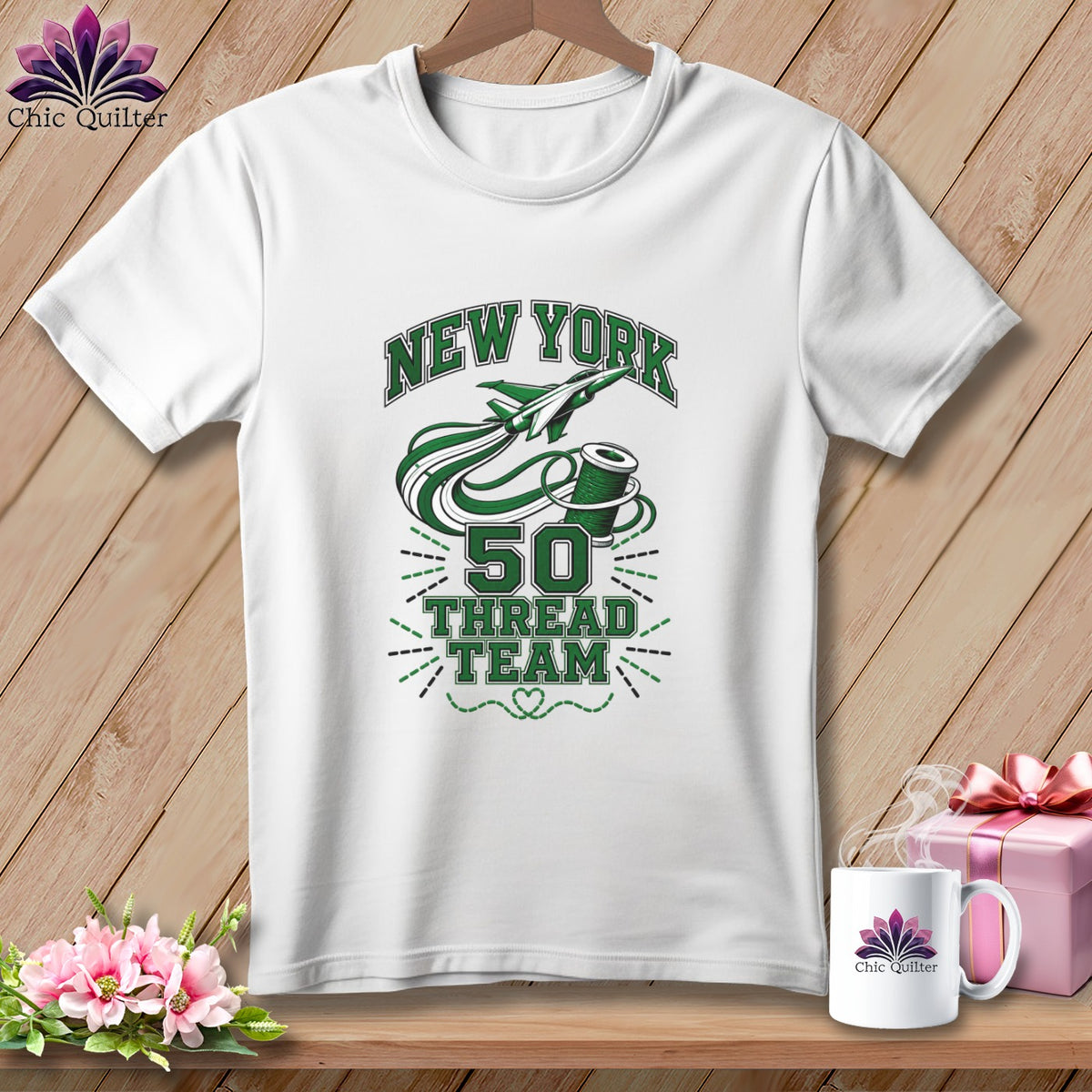A white t-shirt on a wooden background features green text that reads New York 50 Thread Team.
