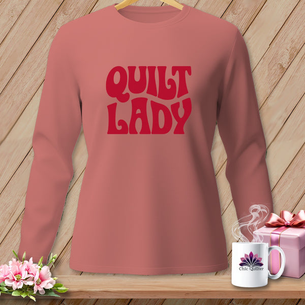 Long-sleeved coral shirt with red "Quilt Lady" text and Chic Quilter mug.