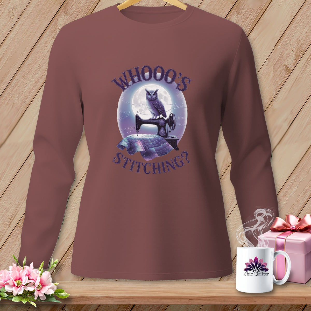 Brown long-sleeve shirt with an owl on a sewing machine and text "WHOOO'S STITCHING?".