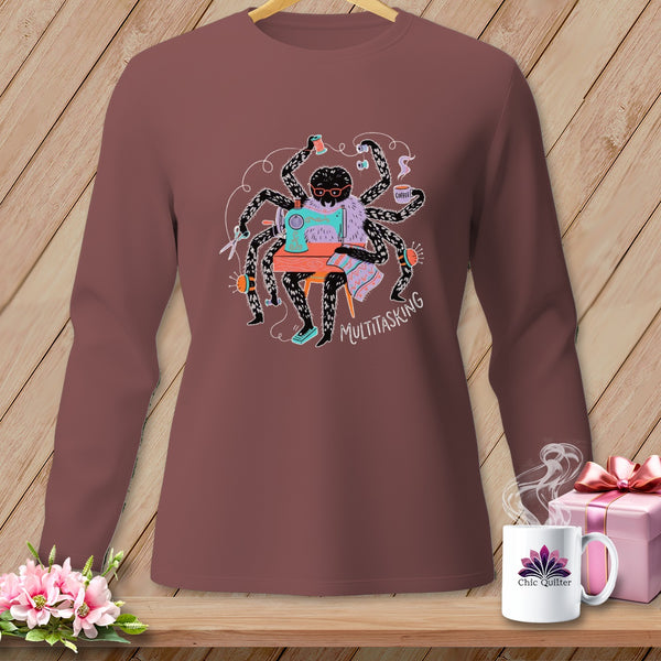 Spider sewing with multiple arms, drinking coffee, text reads "MULTITASKING".