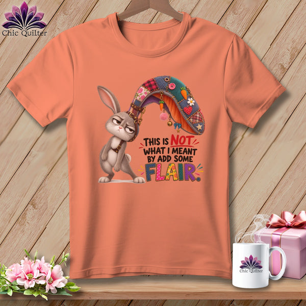 T-shirt with a grumpy bunny wearing a patchwork ear and text "This is not what I meant by add some flair."