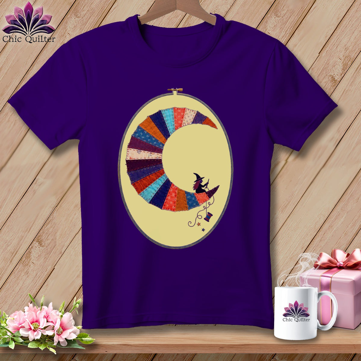 Purple t-shirt with crescent moon quilt design featuring a witch and a sewing spool.