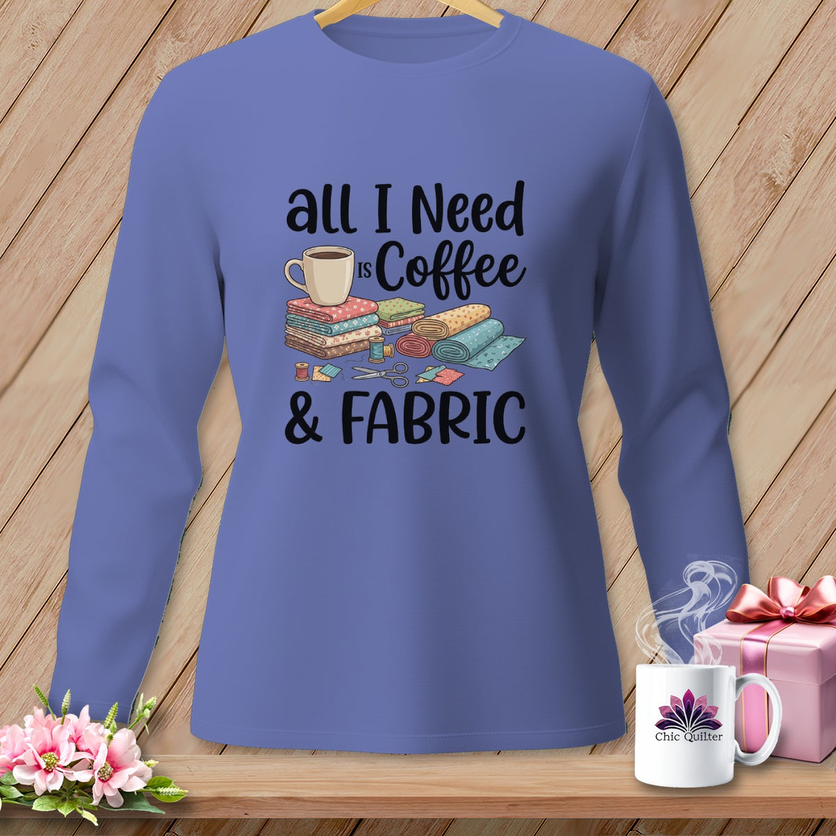 Long-sleeved shirt with "All I Need Is Coffee & Fabric" graphic and sewing illustration.