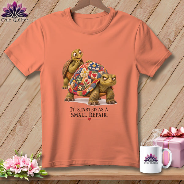 Peach t-shirt with two tortoises, one with a quilt pattern shell, and text "IT STARTED AS A SMALL REPAIR."