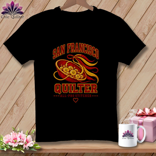 Black t-shirt featuring a red bowl of buttons graphic with San Francisco Quilter text on a wooden surface.