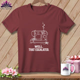 Maroon t-shirt with white line art of a sewing machine and text 