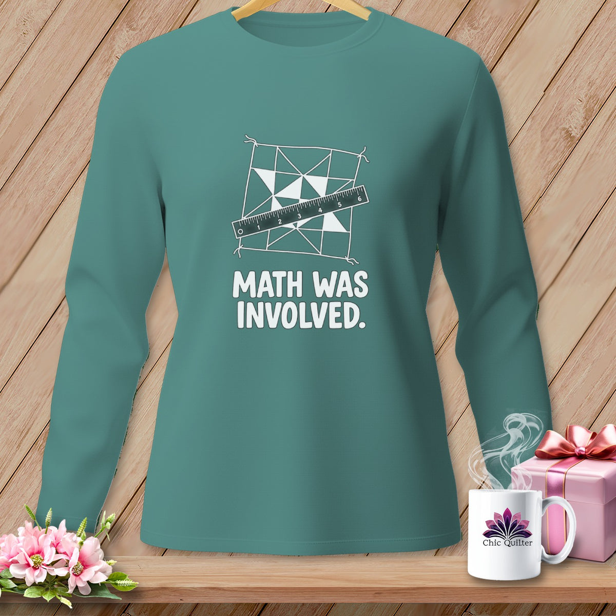 Teal long-sleeve shirt with "MATH WAS INVOLVED" text and a quilting design.