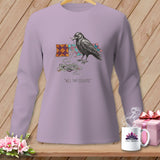 Lavender long-sleeve shirt with a crow and yarn illustration and quote.