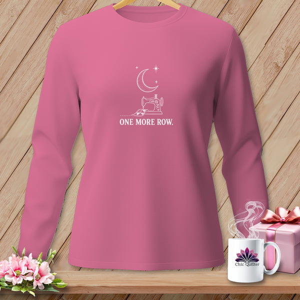 Pink long-sleeve shirt with moon, sewing machine, and "ONE MORE ROW" text.