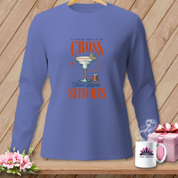 Purple long-sleeve shirt with "If you're going to be cross, then bring stitches" text and graphics.