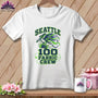White t-shirt with a blue and green graphic featuring a bird, spool of thread, and text reading Seattle 100 Fabric Crew.