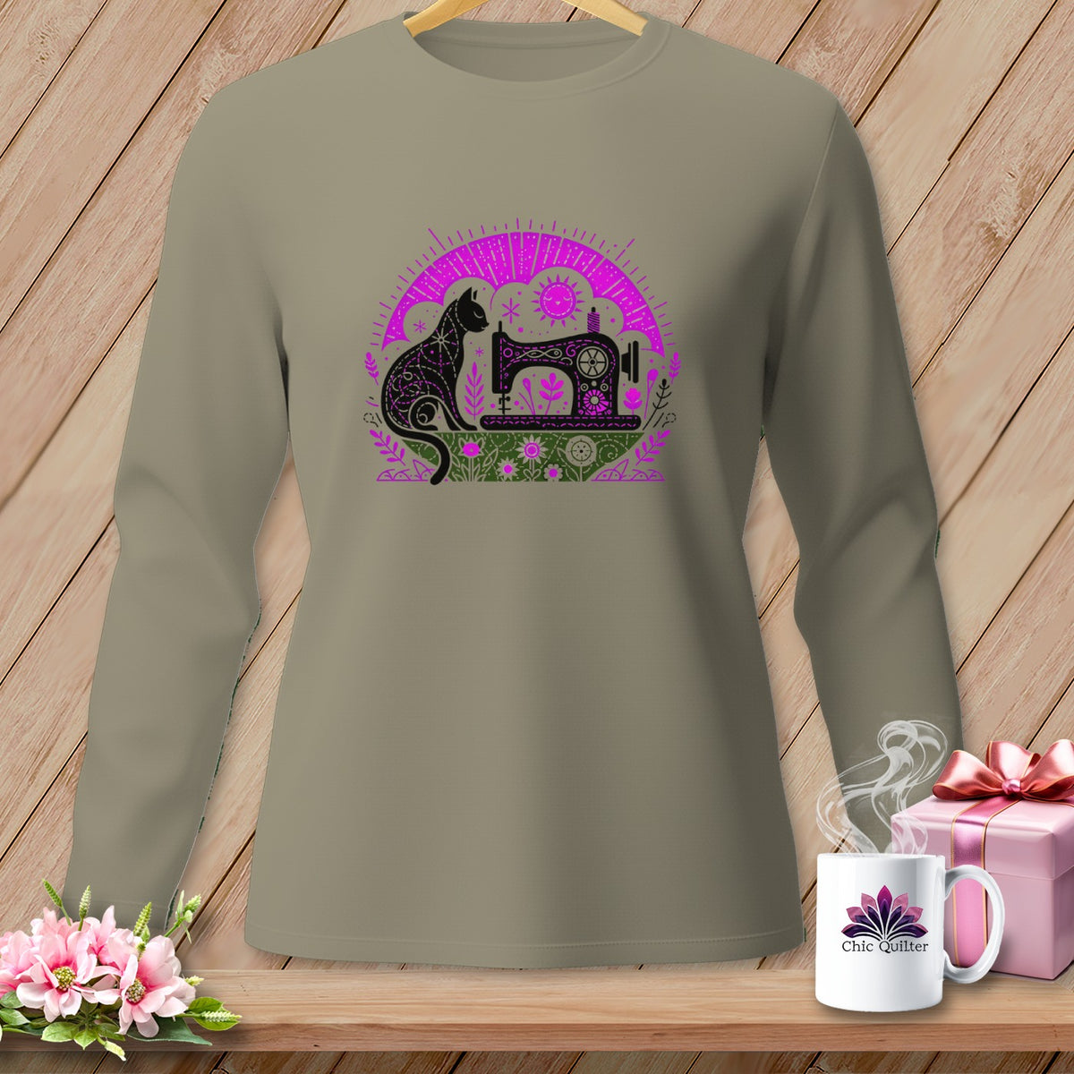 Long-sleeve shirt with a black cat and sewing machine graphic.
