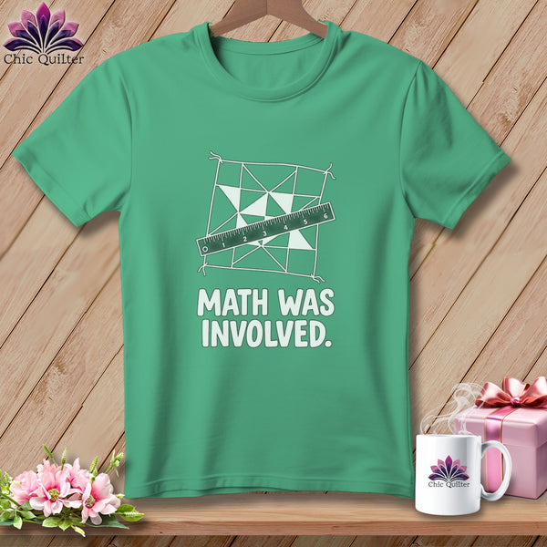Green t-shirt with quilt design, ruler, and text "MATH WAS INVOLVED."
