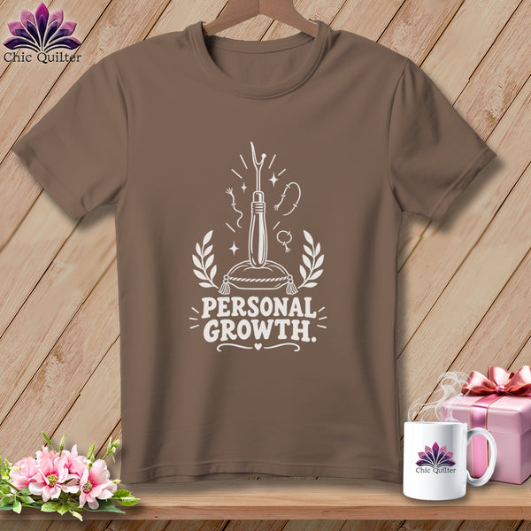 Brown t-shirt with "Personal Growth" text and sewing illustration.