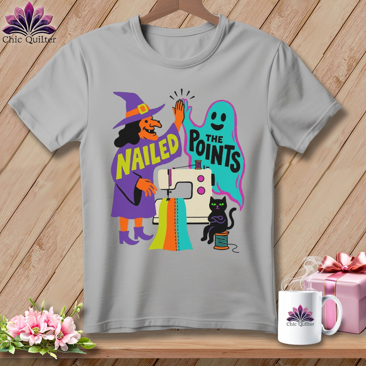 Witch, ghost, cat, and sewing machine graphic with text "NAILED THE POINTS".