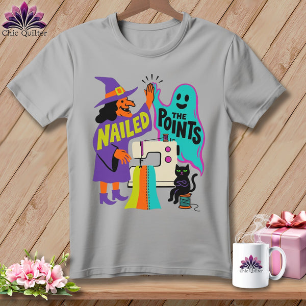 Witch, ghost, cat, and sewing machine graphic with text "NAILED THE POINTS".